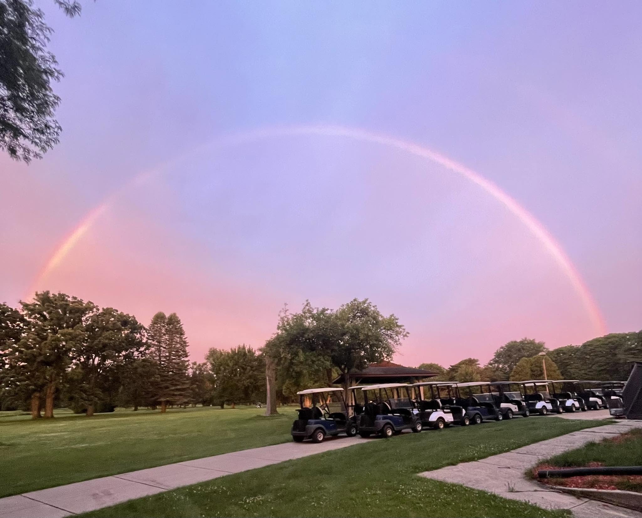 A rainbow over the golf course and cart fleet at Columbus Country Club